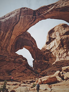 people standing near mountain during daytime thumbnail