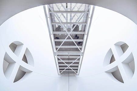 gray birdcage in white structure thumbnail