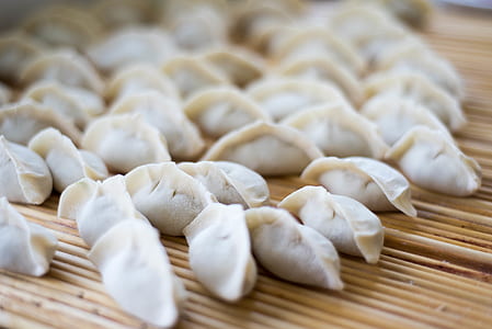 dumplings on woven tray thumbnail