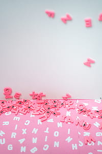 aerial photography of pink alphabet magnets thumbnail