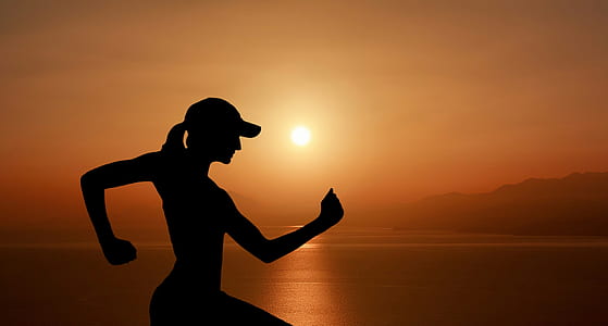 silhouette photography of woman near seashore thumbnail