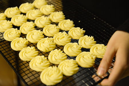 Person Holding Tray of Cookies thumbnail