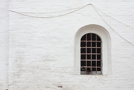 gray metal grille on window near concrete wall thumbnail