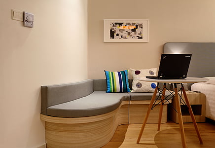white painted room filled with furniture and black laptop computer thumbnail
