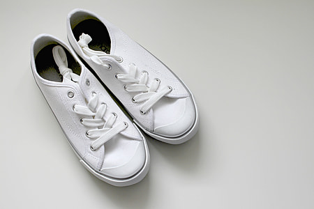 pair of white low-top sneakers thumbnail