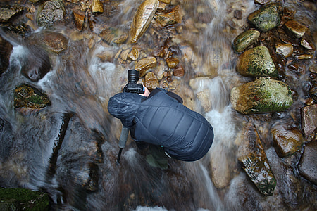 Camera man on water stream thumbnail