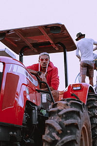 man riding tractor thumbnail