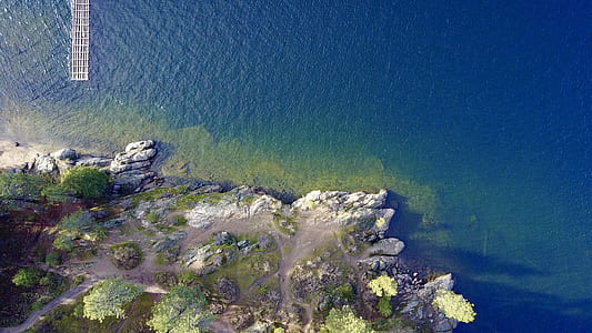 body of water near island at daytime thumbnail