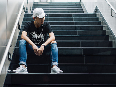 man in black T-shirt listening in radio thumbnail