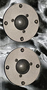 flay lat photography of two round speakers thumbnail