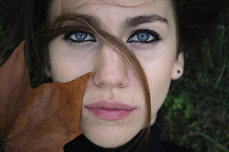 woman in black turtleneck top and brown maple leaf thumbnail