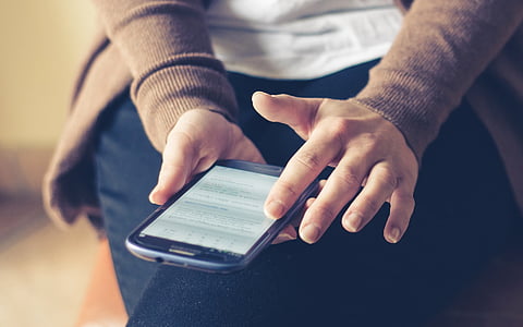 person holding black Samsung smartphone thumbnail