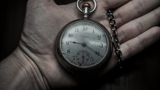 person holding pocket watch at 9:20 thumbnail