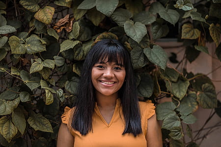 Portrait Photo of Woman in Yellow Top Smiling thumbnail