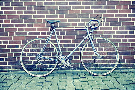 gray bike behind brown wall thumbnail