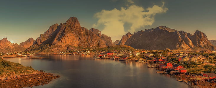 houses near mountain and lake at daytime thumbnail