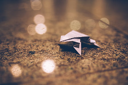 origami in gray surface selective focus photography thumbnail