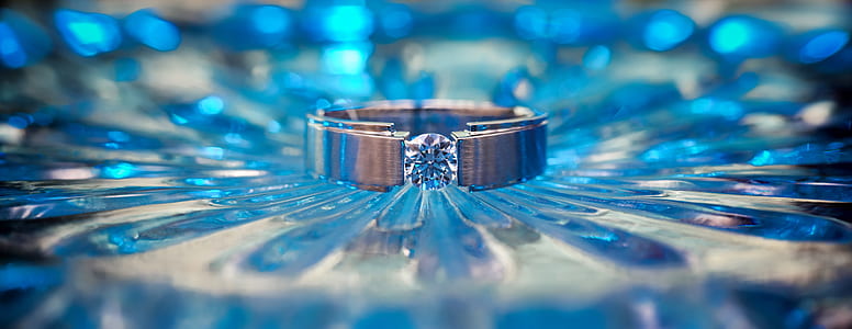 selective focus photo of silver-colored and clear gemstone ring thumbnail
