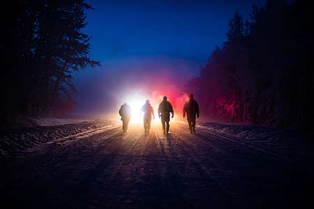 silhouette of 4 persons walking in road thumbnail