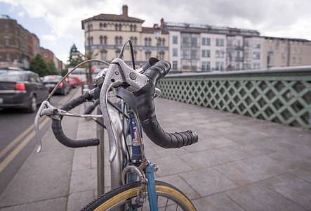 road bicycle parked near rail thumbnail