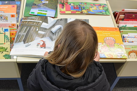 toddler girl reading book thumbnail