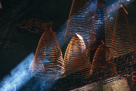 brown steel hanging decors in dark enclosure thumbnail