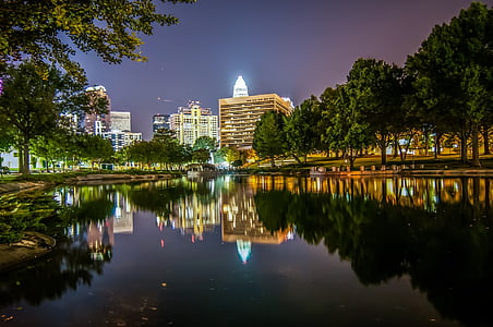 long-angle photography of cityscape by night thumbnail