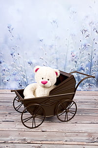 white bear plush toy on brown steel stroller thumbnail