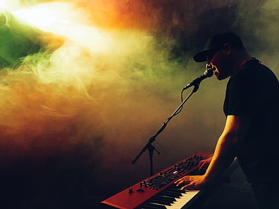 man playing keyboard while singing thumbnail