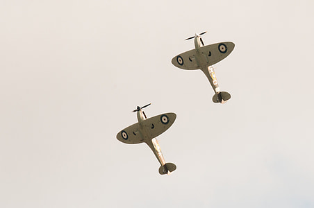 two biplanes performing in sky thumbnail