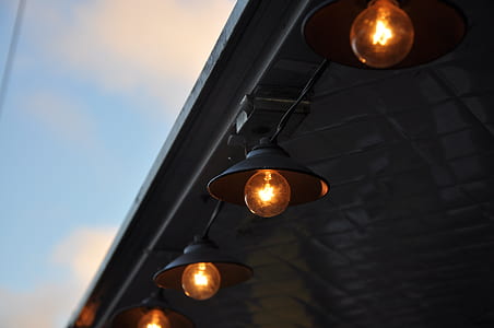 four orange light bulbs thumbnail