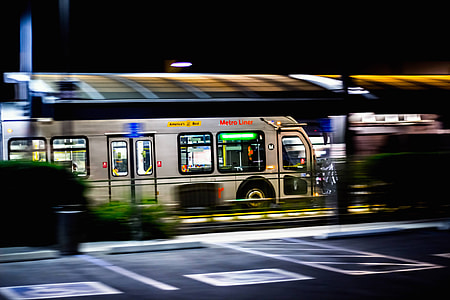 time lapse photo of person riding train during nighttime thumbnail
