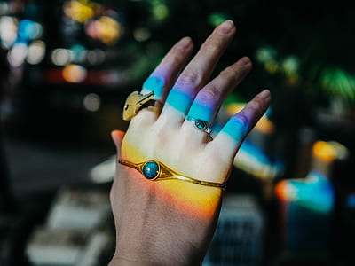 person with gold-colored bracelet thumbnail