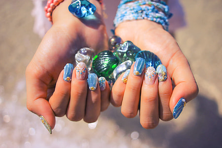 gemstones in womans hand thumbnail