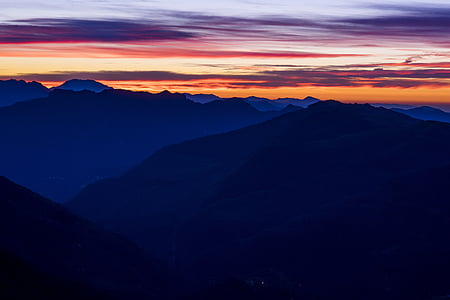 silhouette photo of mountains during sunset thumbnail