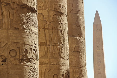 photo of brown pillars with hieroglyphs thumbnail