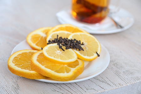 sliced lemon fruits filled white plate thumbnail