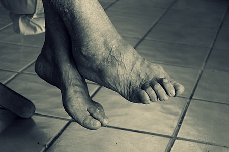 grayscale photo of humans feet thumbnail
