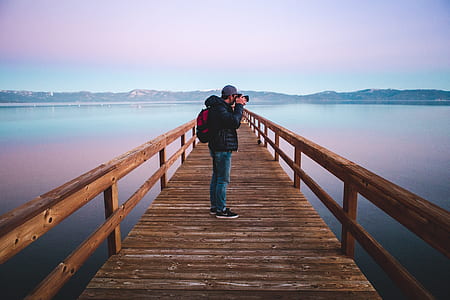 man taking picture on duck bridge thumbnail