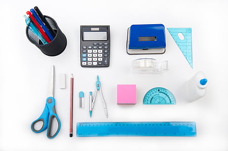 black desk calculator, blue scissor and glue bottle thumbnail