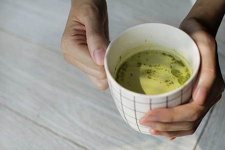 person holding mug thumbnail