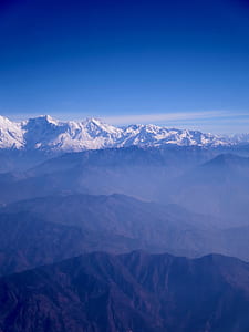aerial view photography of mountains under sunny sky thumbnail