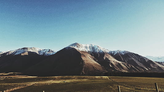 snow covered mountain during daytime thumbnail