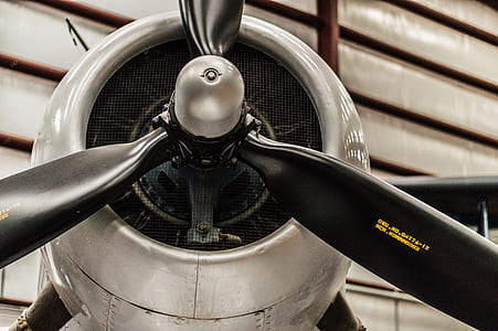grayscale photography of propeller plane thumbnail