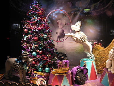 white dog figurine beside christmas tree inside the room thumbnail
