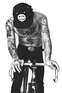 grayscale man riding bike thumbnail