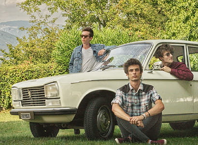 Shallow Focus Photography of Three Men With White Car Surrounded of Trees thumbnail