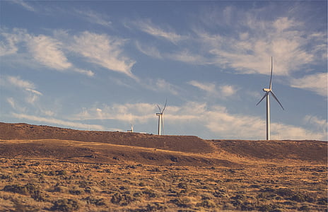 wind mills on valley during daytime thumbnail