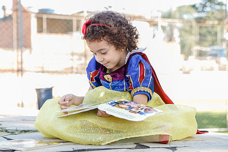 girl in Snow White costume reading book thumbnail