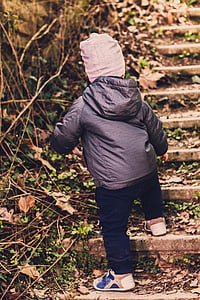 toddler walking on concrete stairs outdoors thumbnail